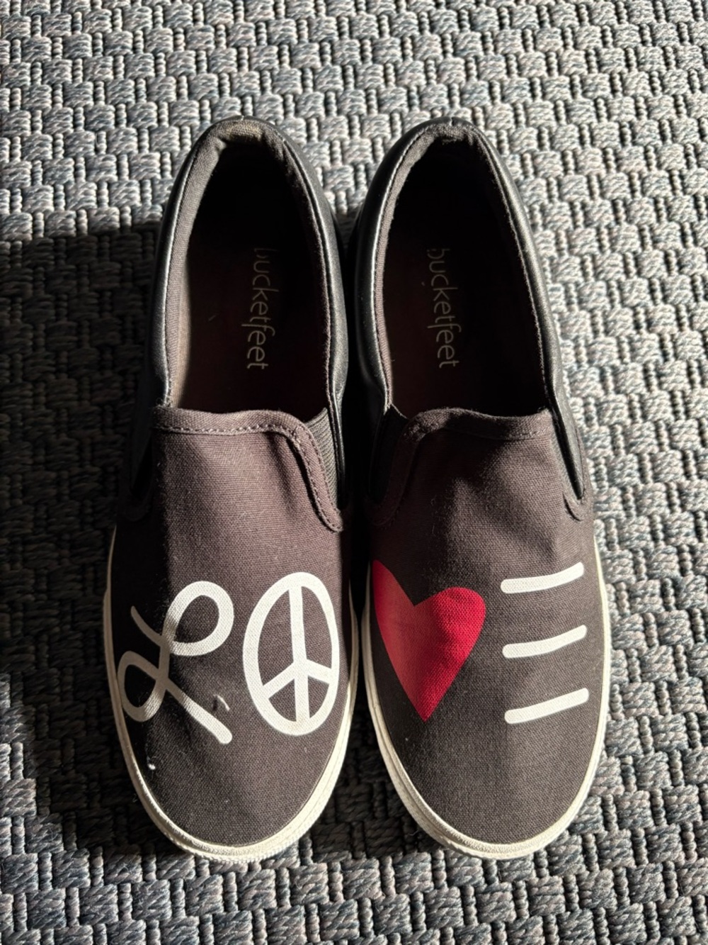 Bucket Feet Women’s Black Slip-On Sneakers with Red Heart & White Graphics